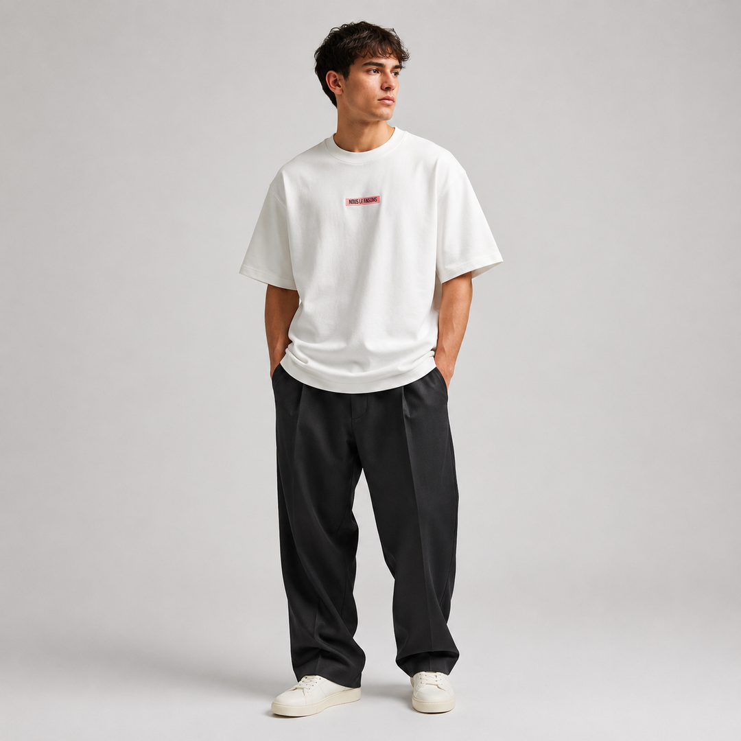 Premium Nous Le Faisons clothing displayed in a luxury lifestyle setting