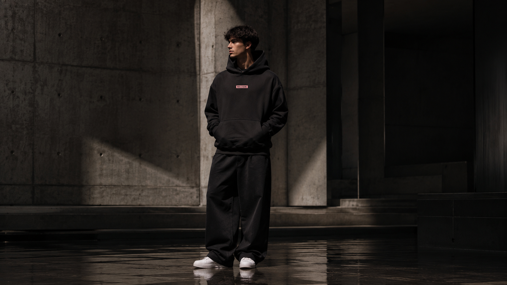 Premium fashion lifestyle scene featuring Nous Le Faisons clothing